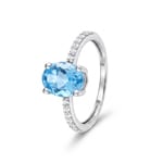 Bague cocktail or gris 375/9 ct avec topaze bleue ovale & zircones