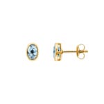 Clous d'oreilles or jaune 750/18 ct avec topaze bleue ovale