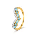 Bague or jaune 375/9 ct avec topaze bleue et zircones