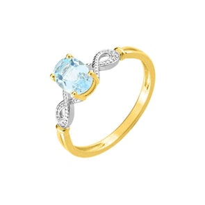 Bague or jaune 750/18 ct bicolor avec topaze bleue ovale et diamants 0.01ct.