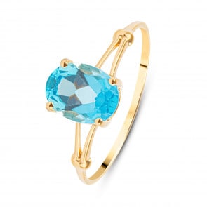 Bague 750/18 K or jaune avec topaze bleue ovale