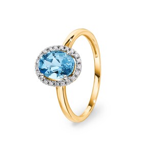 Bague or jaune 750/18 ct avec topaze bleue ovale et diamants 0.06 ct H/si