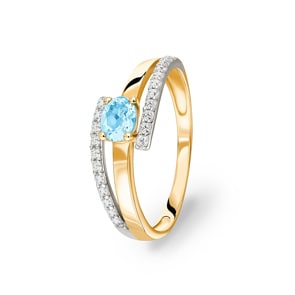 Bague or jaune 750/18 ct avec topaze bleue ovale et zircones
