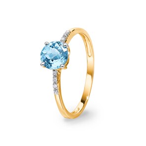 Bague or jaune 750/18 ct avec topaze bleue ronde et diamants 0.02 ct H/si