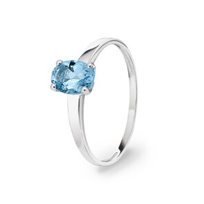 Bague or gris 750/18 ct avec topaze bleue ovale