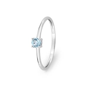 Solitärring 750/18 K Weissgold mit Blautopas rund